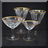 G61. Various gold rimmed glasses 